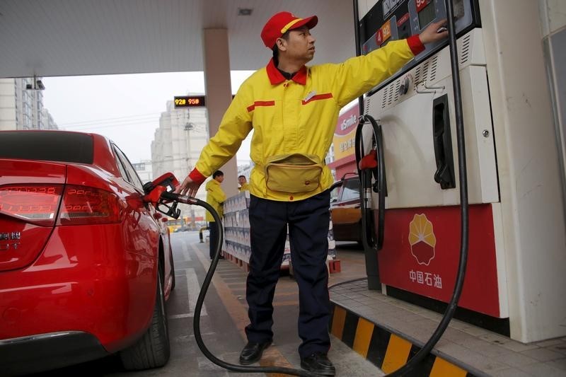 Oil prices edge lower; set for positive week on Chinese optimism